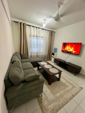 Modern,Fully Furnished 3 bedroom Bnb with a functional Kitchen and access to Gym, Swimming pool and a basketball court